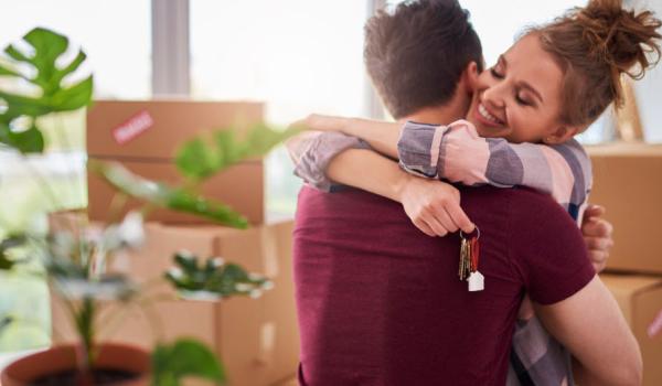 a couple moving into their new home